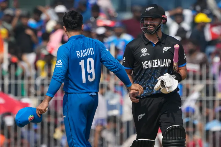 New Zealand's captain Mitchell Santner shakes hands with Afghanistan's captain Rashid Khan at the end of the ICC Men's T20 Cricket World Cup 2026 cricket match between Afghanistan and New Zealand