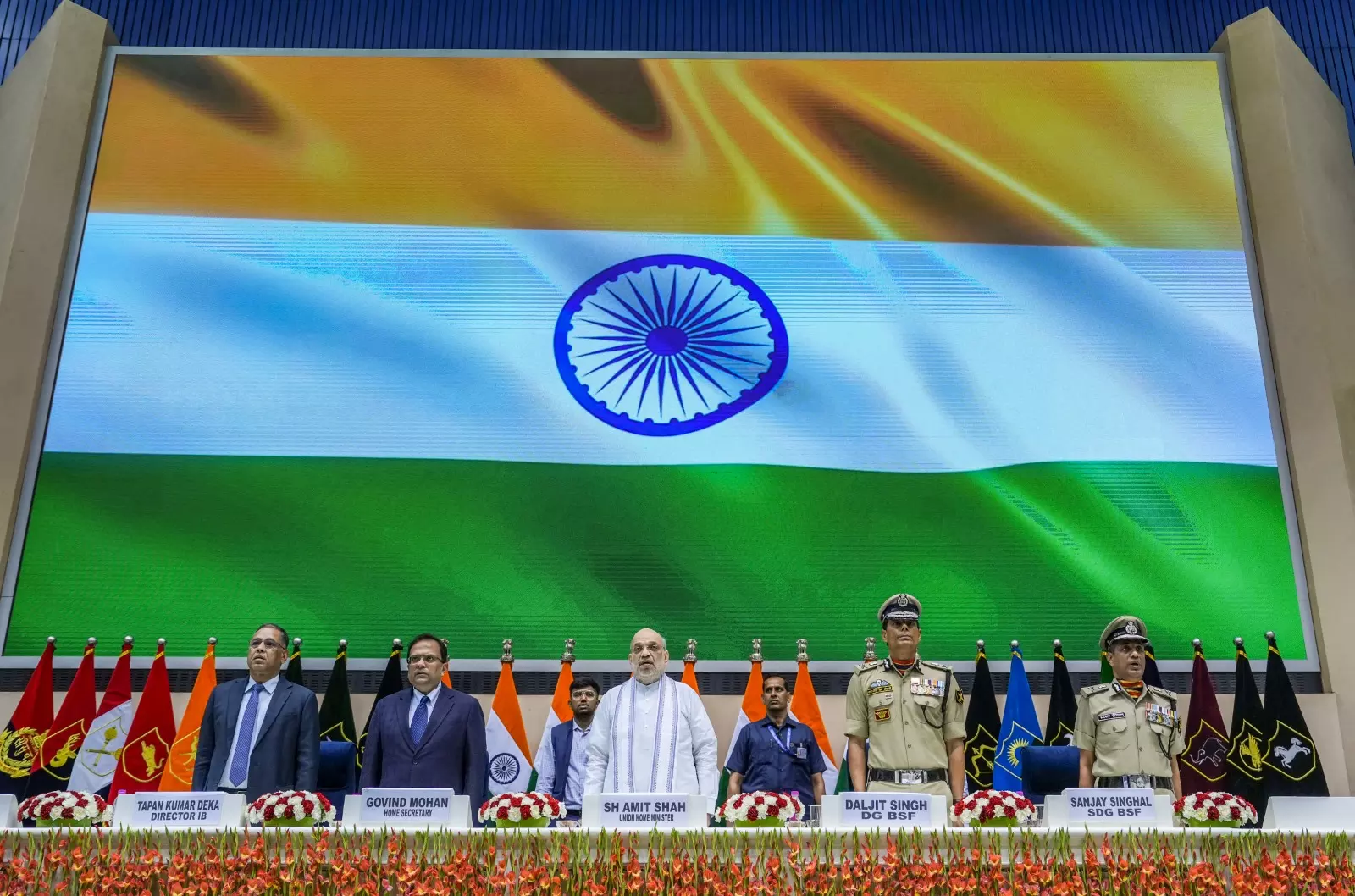 Union Home Minister Amit Shah, Border Security Force (BSF) Director General Daljit Singh Chaudhary, Home Secretary Govind Mohan and others stand during the national anthem at the BSF Investiture Ceremony and Rustamji Memorial Lecture, in New Delhi 