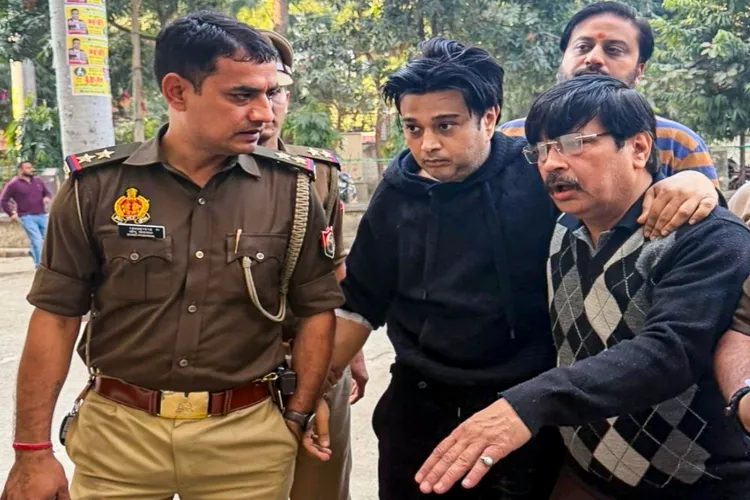 Shivam Mishra, centre, son of local tobacco baron K K Mishra, being produced at a court after his arrest in connection with the high-profile Lamborghini crash that left several people injured on the VIP Road earlier this week, in Kanpur