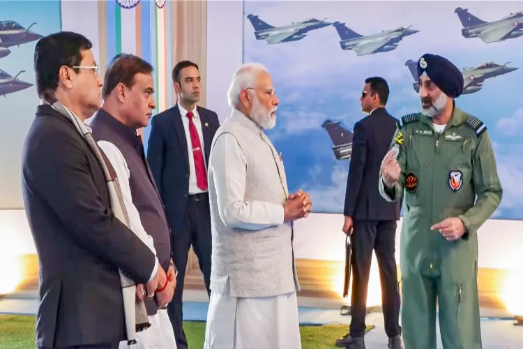 Prime Minister Narendra Modi with others witnessing an aerial show featuring IAF's fighter jets and transport helicopters at the Emergency Landing Facility, Assam