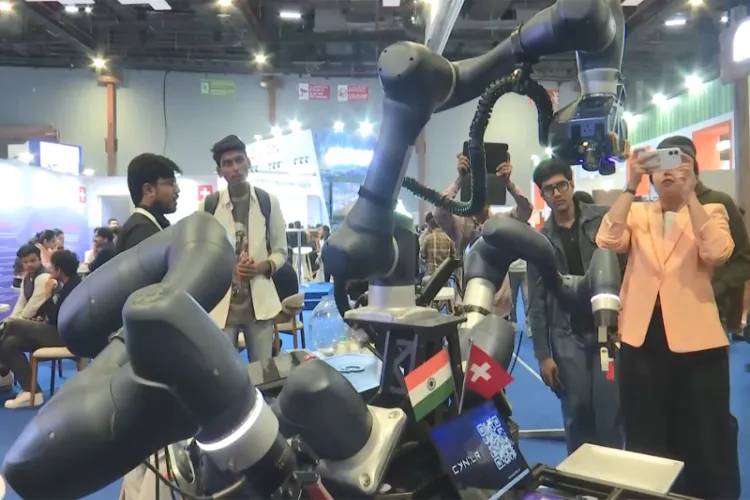 CyRo, the stationary robot developed by CynLr, demonstrates intuitive object handling at the AI Impact Summit pavilion in New Delhi. 