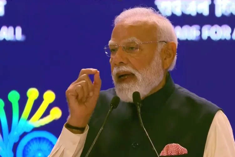 Prime Minister Narendra Modi addressing the AI India Impact Summit at the Bharat Mandapam