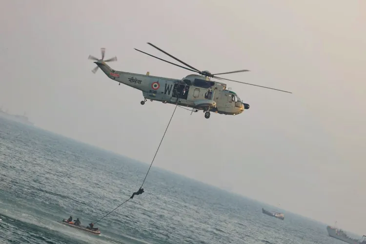 An amphibious combat vehicle makes a beach landing demonstration during a maritime display held as part of the International Fleet Review