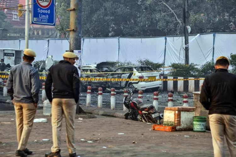 Police personnel at the site of November 2025 Delhi blast
