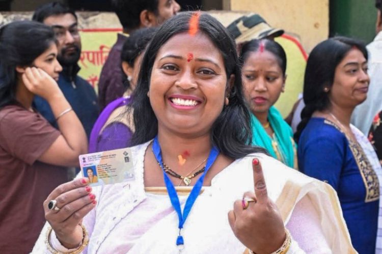 BJP candidate for mayor Roshni Khalkho shows her indelible ink-marked finger after casting a vote during the Ranchi Municipal Corporation (RMC) election, in Ranchi, Jharkhand