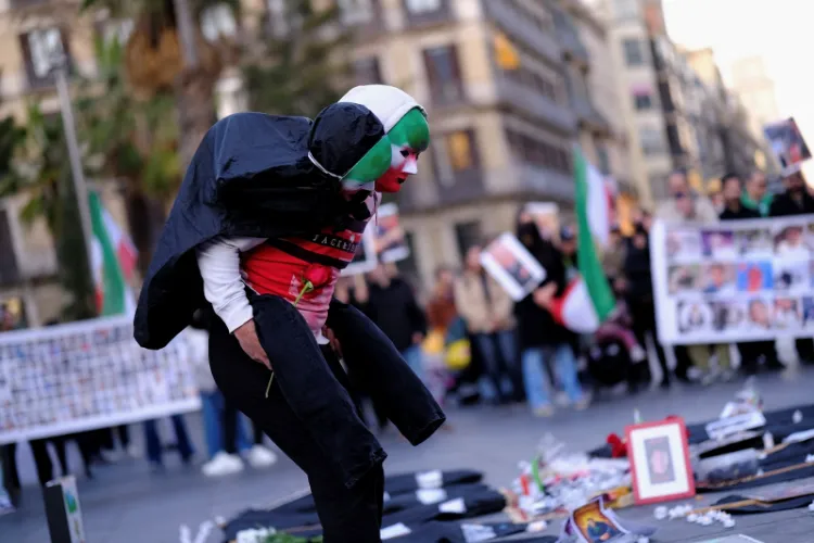 An Iranian resident performs during a protest. 
