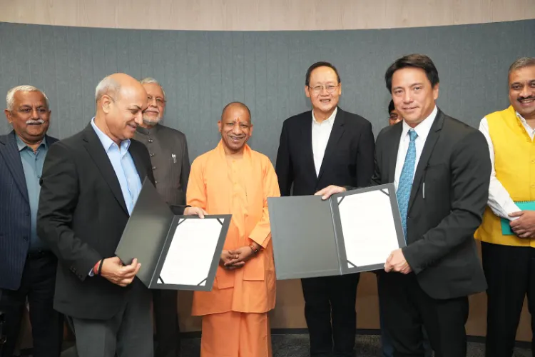 UP CM Yogi Adityanath with Dr. Tan See Leng, Minister for Manpower and Minister in-charge of Energy and Science & Technology, Singapore, and Mr. Kong Wy Mun, Chief Executive Officer, Singapore Cooperation Enterprise.