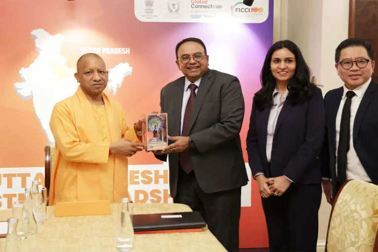 UP CM Yogi Adityanath with President and Group CEO of ST Telemedia Global Data Centres Bruno Lopez in Singapore. 