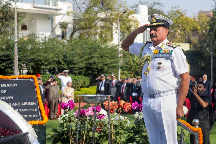 Chief of the Naval Staff (CNS) Admiral Dinesh K Tripathi gives salute after offering a wreath to martyrs at the Shaheed Smarak