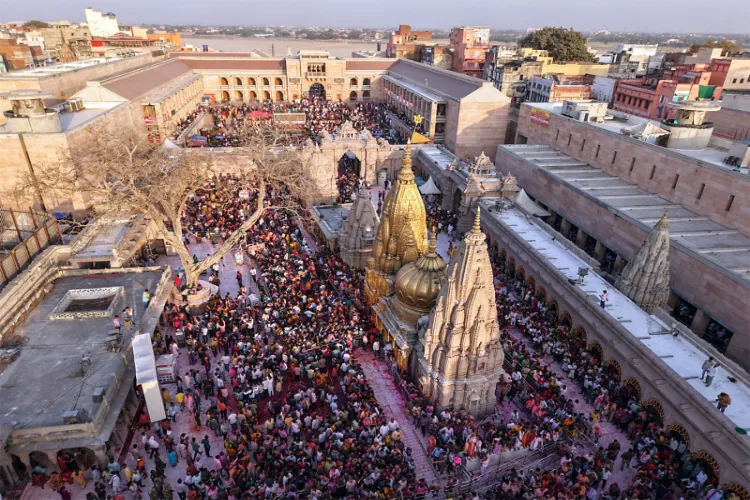 Devotees celebrate Holi during Rang Bhari Ekadashi at Kashi Vishwanath Temple, in Varanasi 