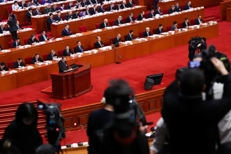 Chinese Premier Li Qiang delivers a work report during the opening session of the National People's Congress (NPC) at the Great Hall of the People in Beijing, China on March 5, 2026.