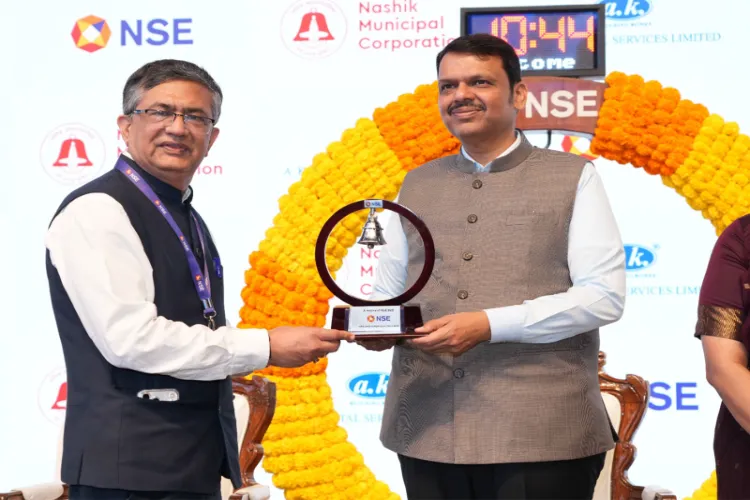 Ashish Chauhan, MD, National Stock Exchange presents a replica of the NSE Bell to Maharashtra’s Chief Minister Devendra Fadnavis 