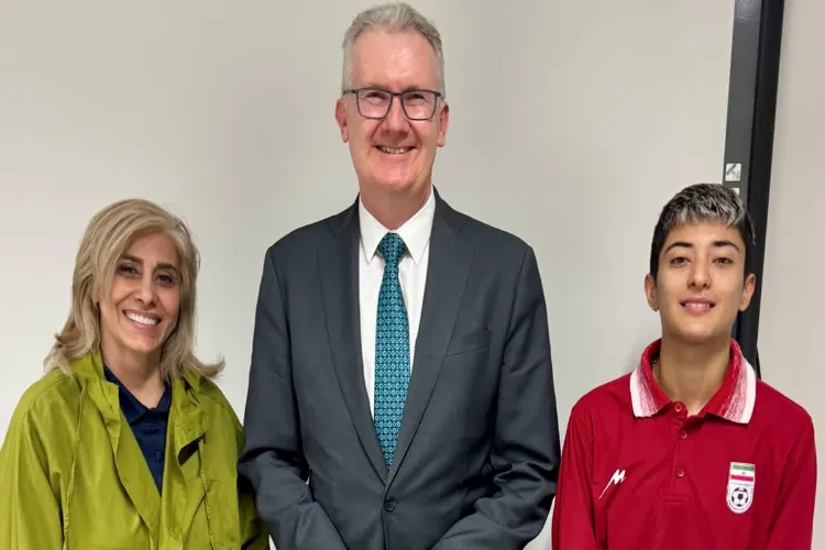 Tony Burke with Iranian soccer players