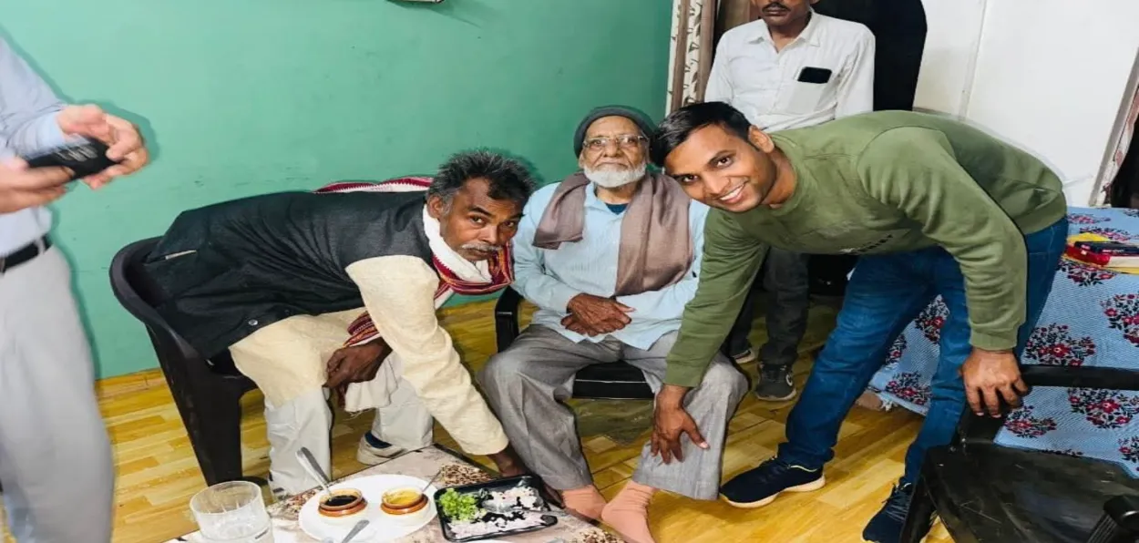 Santosh kumar and his father touching the feet of Guru Habib