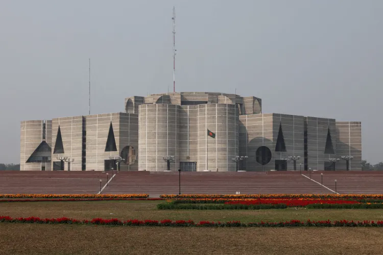 The national flag of Bangladesh flies in front of the Jatiya Sangsad (Parliament) building in Dhaka.