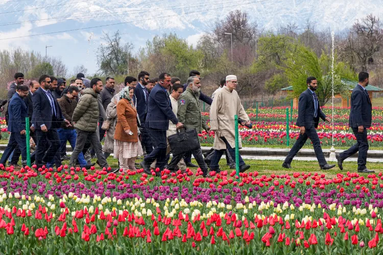 Jammu and Kashmir Chief Minister Omar Abdullah poses for a sefie during a visit to the Tulip Garden, in Srinagar