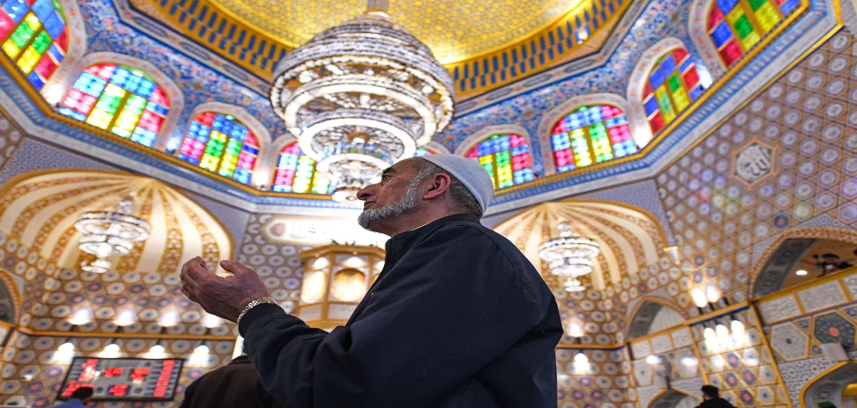 A devotee is praying at Hazratbal shrine in Srinagar, J&K (Photo: Basit Zargar)