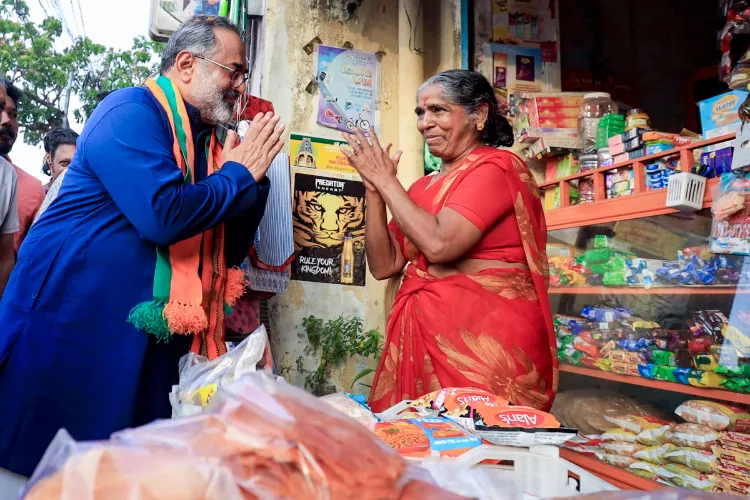 BJP Kerala President and candidate from Nemom Assembly constituency, Rajeev Chandrasekhar, interacts with an elderly during campaigning for state Assembly elections, in Thiruvananthapuram