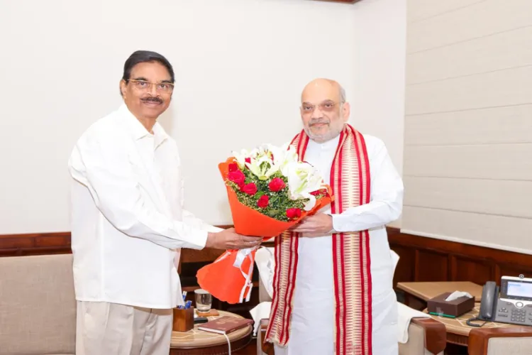 Governor of Odisha Haribabu Kambhampati and Union Home Minister Amit Shah 