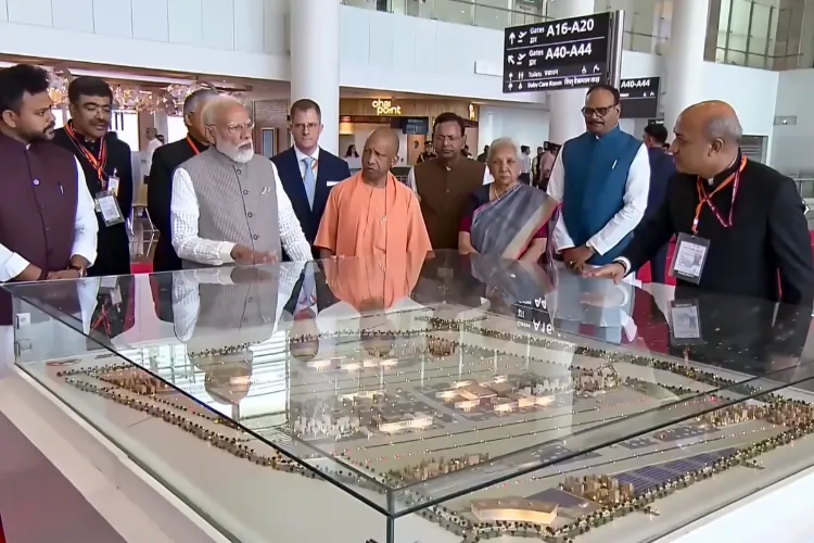 Prime Minister Narendra Modi interacts with Uttar Pradesh Chief Minister Yogi Adityanath during inauguration of the newly constructed Noida International Airport