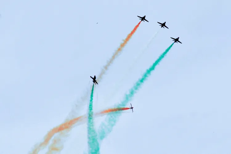 Indian Air Force's (IAF) Surya Kiran Aerobatic Team (SKAT) performs manoeuvres during an air show, near Sukhna Lake in Chandigarh