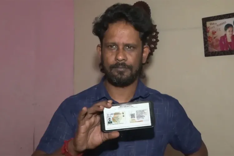 Gokuleswaran, a resident of Sri Lankan Tamils Rehabilitation Camp in Tiruchipalli shows his new voter ID 
