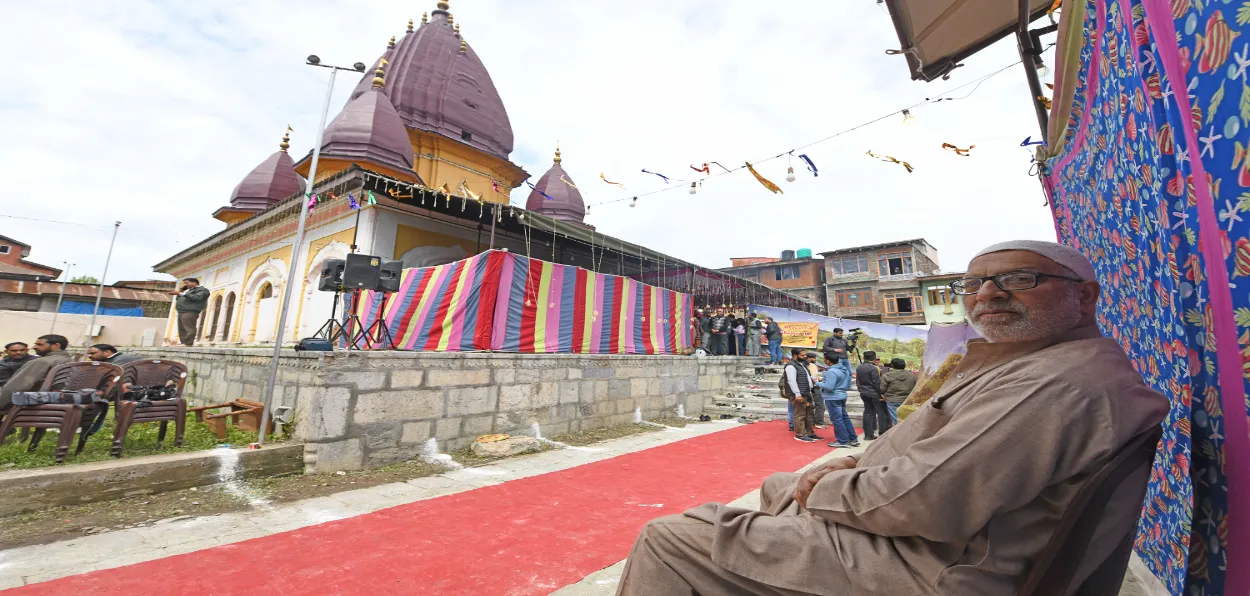 A Kashmiri Muslim siting in the premises of reopened Raghunath Mandir in Srinagar (Basit Zargar0