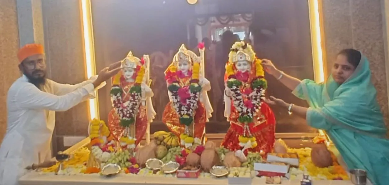 Taufiq Shabuddin Syed and his wife Parveen Syed placing silver crown on the head of he deity in Ram temple