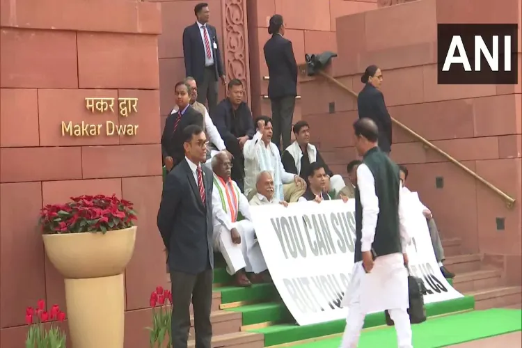 Opposition MPs protesting at the Makar Dwar of Parliament