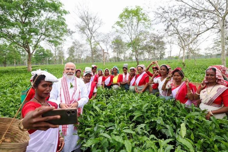 Prime Minister Narendra Modi with tea garden workers in Assam's Dibrugarh