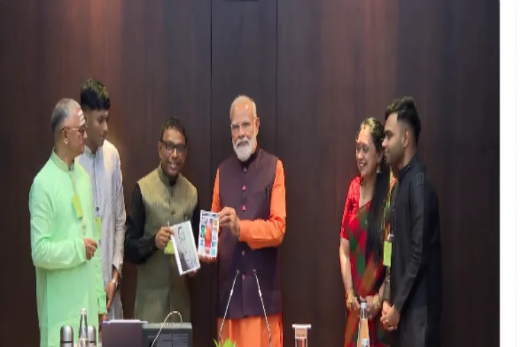 Prime Minister Narendra Modi with renowned music composer Ramesh Vinayakam and his family in Chennai