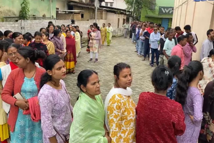 Voters standing in a queue to cast their votes 