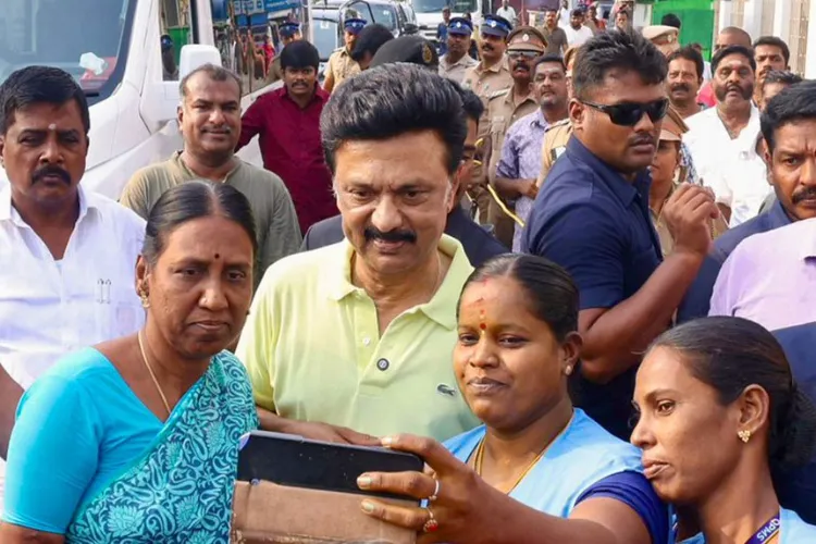 Tamil Nadu Chief Minister MK Stalin pose for a group selfie during an election campaign 