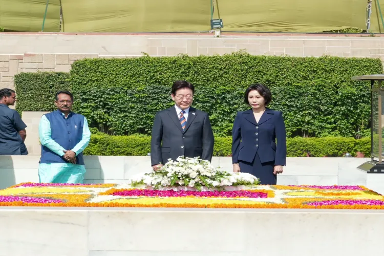 South Korean President Lee Jae-myung and First Lady Kim Hea-kyung pay tribute to Mahatma Gandhi at Rajghat during their state visit to India.