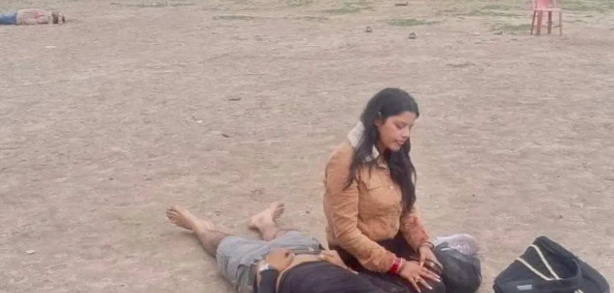 The shocking image of a woman sitting by body of her husband killed by terrorists in Baisaran on April 22, 2024