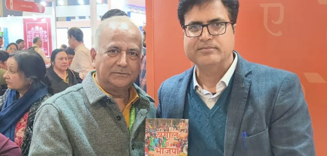 Manjit Thakur with his book