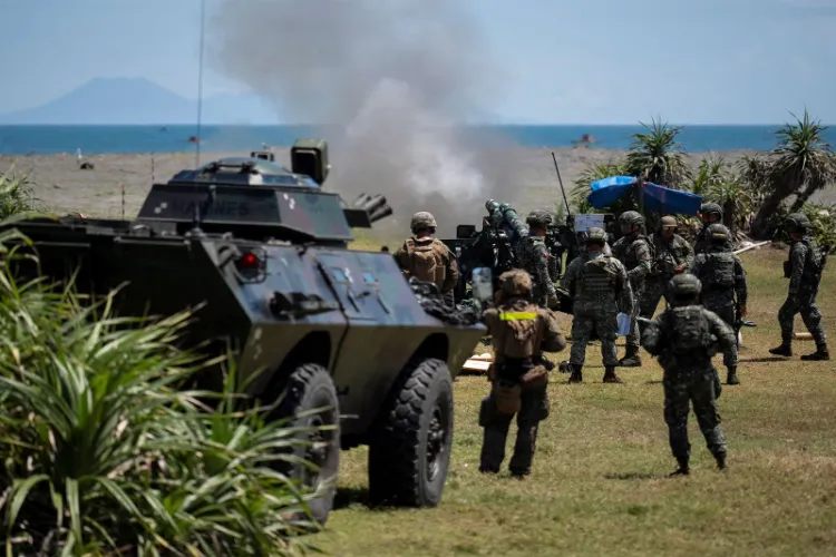 US and Philippine soldiers fire a howitzer during the annual Balikatan joint military exercises in Aparri, Cagayan province, Philippines