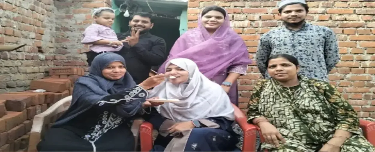 Rashida with her family celebrating her success