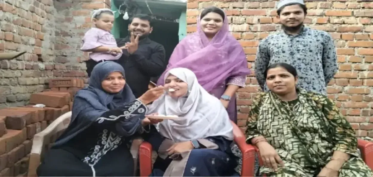 Rashida with her family celebrating her success