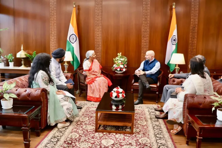 Uber Chief Executive Officer Dara Khosrowshahi with Union Finance Minister Nirmala Sitharaman 