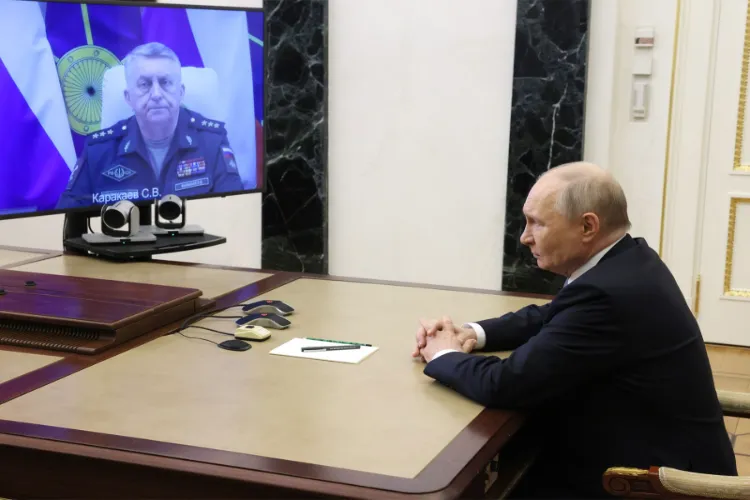 Russian President Vladimir Putin speaking to Russia's Strategic Missile Forces Commander Sergei Karakayev 