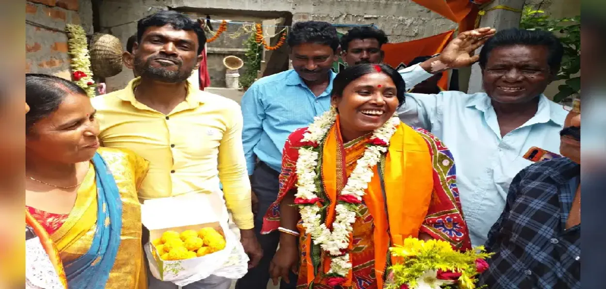Kalita Manji at her home after her victory