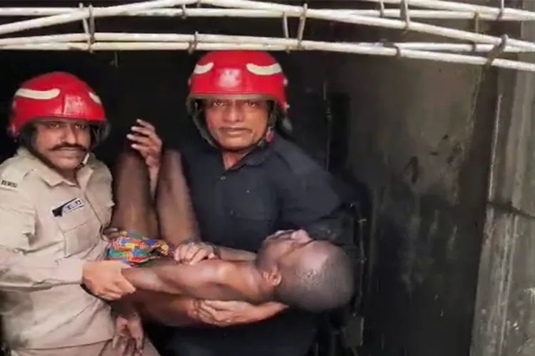 Delhi Fire services rescue an injured victim from site of fire 