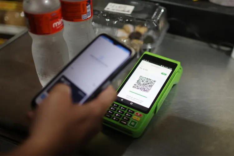 A customer makes a payment using Brazil’s instant payment system, Pix, at a store in Rio de Janeiro.