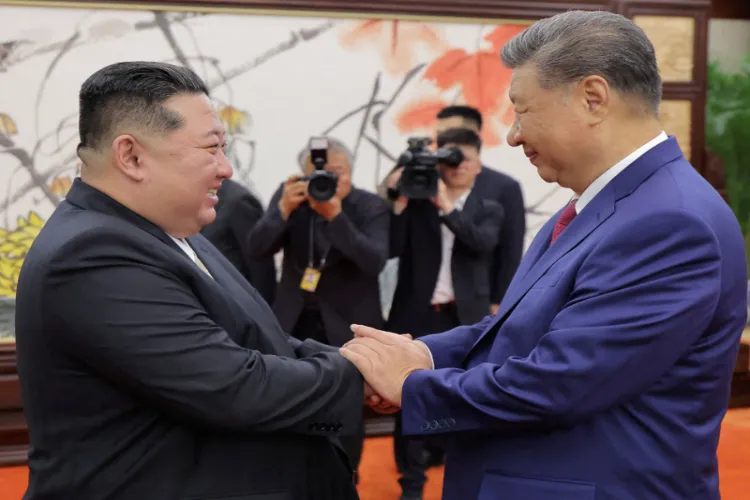 A file photo of North Korean leader Kin Jong-un with Chinese President Xi Jinping