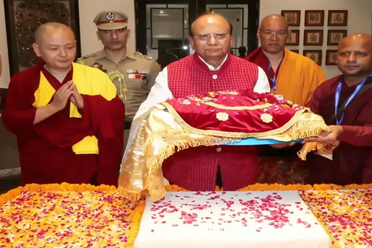 Lieutenant Governor of Ladakh Vinai Kumar Saxena carrying the holy relics