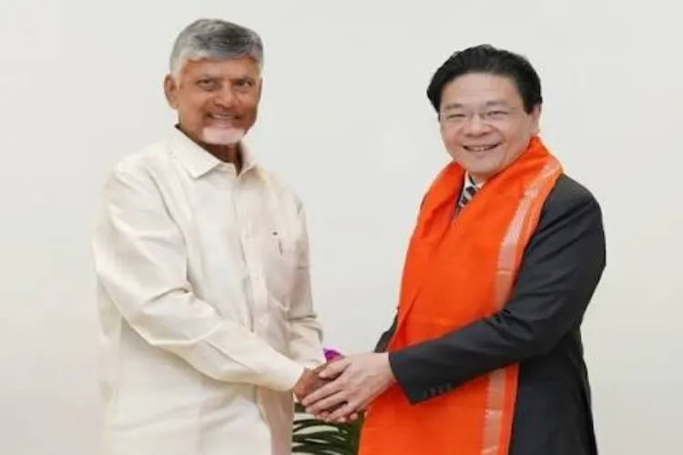 Andhra Pradesh Chief Minister N Chandrababu Naidu, left, exchanges a handshake with Singapore Prime Minister Lawrence Wong during a meeting.