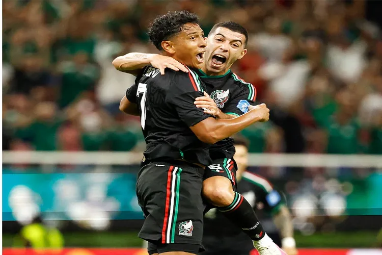 Mexico players celebrating a goal in Group A match against South Korea.