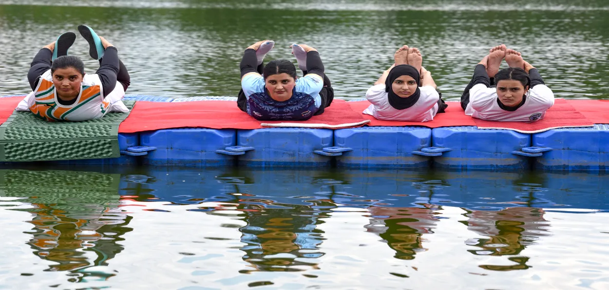 Yoga practice in Pokhribal water channel, Srinagar (Basit Zargar)