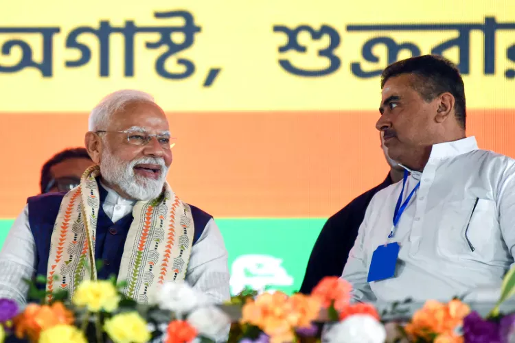 Prime Minister Narendra Modi and West Bengal CM Suvendu Adhikari 